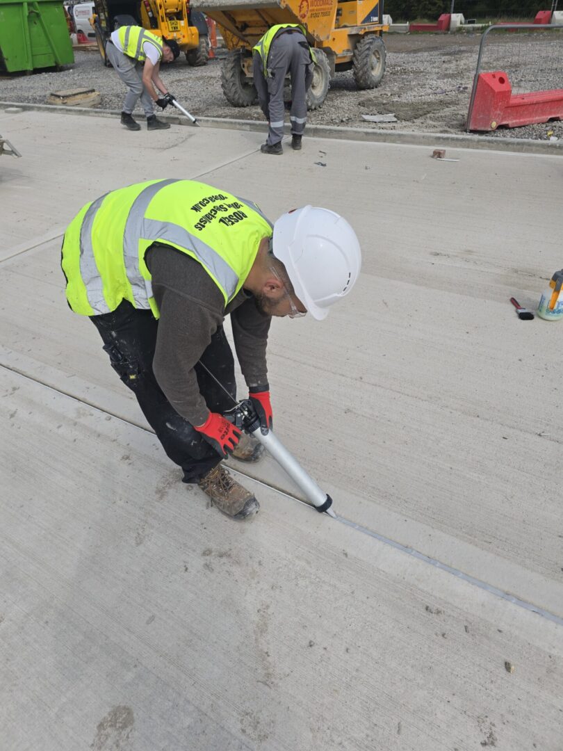 mastic sealant contractors applying sealant to carpark joints from ROSEAL company