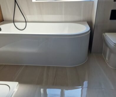 Neat silicone sealant finish around bathroom bath in Dorchester property