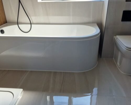 Neat silicone sealant finish around bathroom bath in Dorchester property