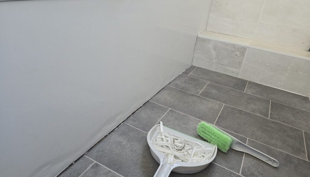 Removing old silicone sealant before resealing a bathroom
