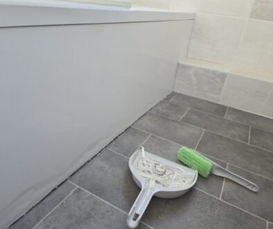 Removing old silicone sealant before resealing a bathroom