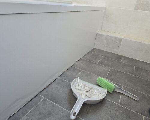 Removing old silicone sealant before resealing a bathroom
